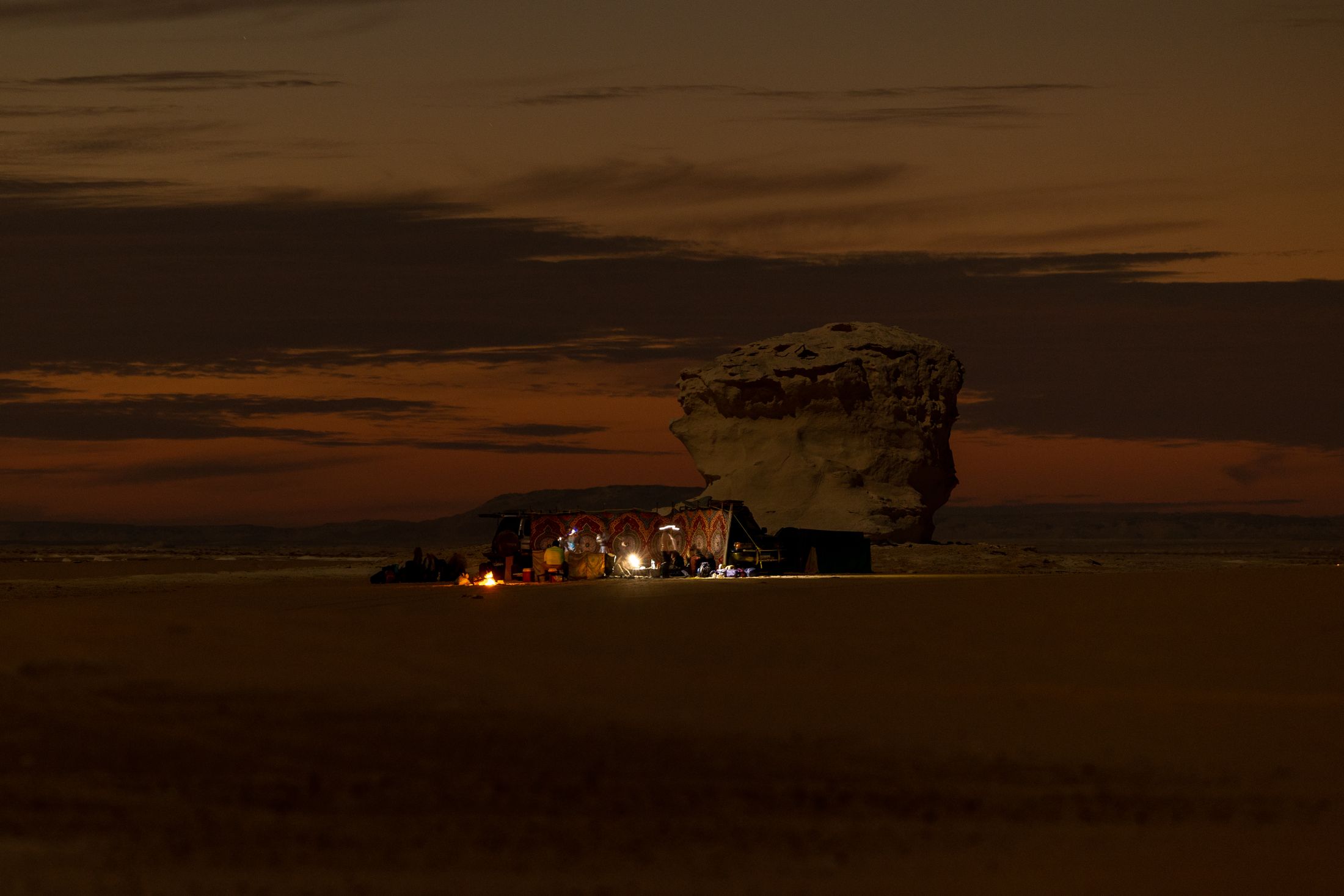 Warm firelight at a Siwa Oasis desert camp